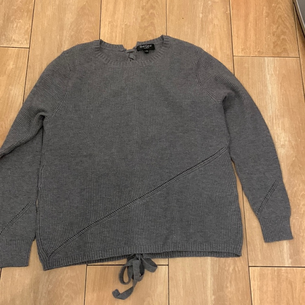 Knit crew sweater with braided back feature